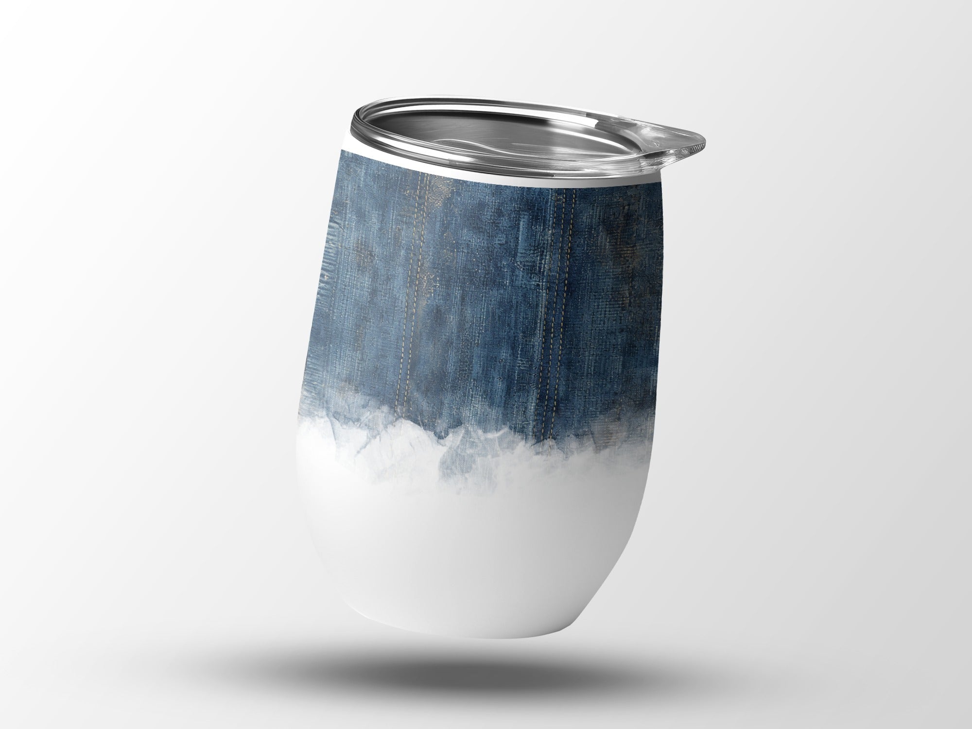 White tumbler with distressed denim pattern and silver lid.