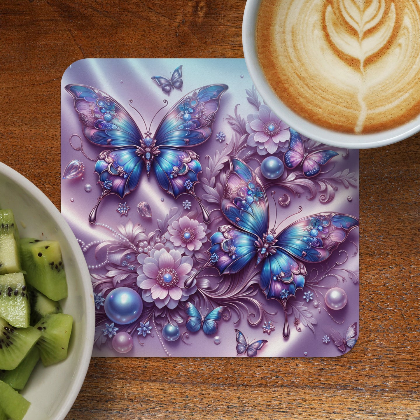 Two iridescent blue butterflies surrounded by flowers, pearls, and crystals on a placemat.