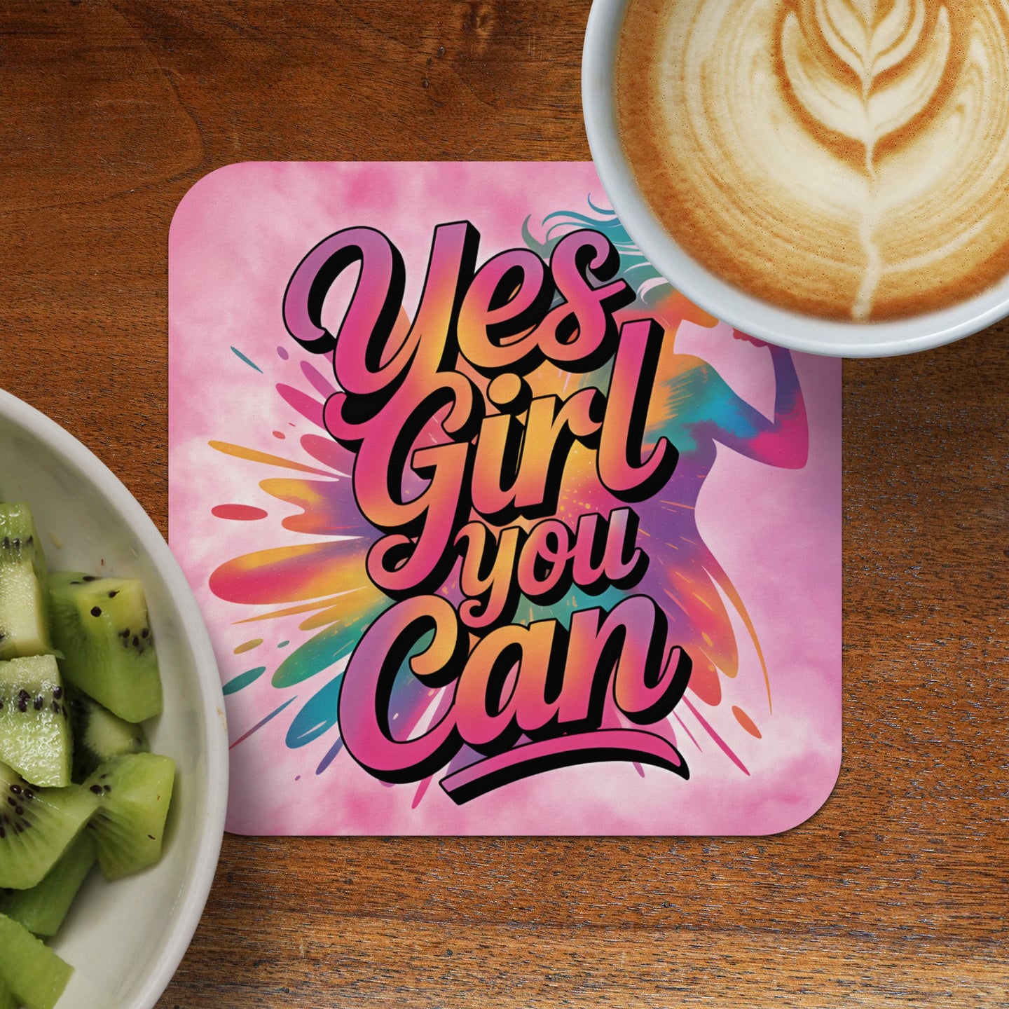 Coaster with "Yes Girl You Can" text and colorful splash behind a silhouette of a woman.