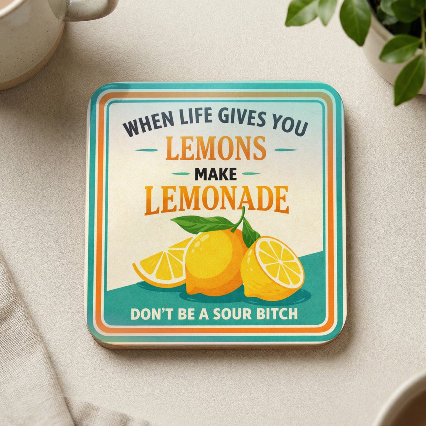 Coaster with lemons and "When life gives you lemons make lemonade" text.