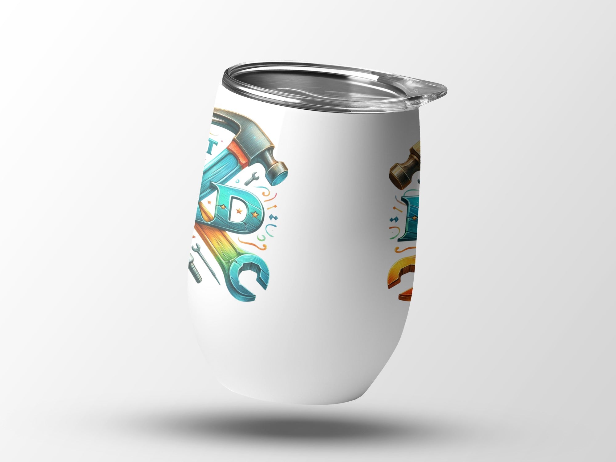 White tumbler with "DAD" in bold letters and tool graphics.