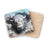 White bison emerging from a cracked, icy background on a cork coaster.