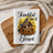 Kitchen towel with birdhouse, sunflowers, and text "Thankful and Blessed".