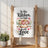 Kitchen towel with "In this Kitchen, we bake with Love" and cookie illustration.