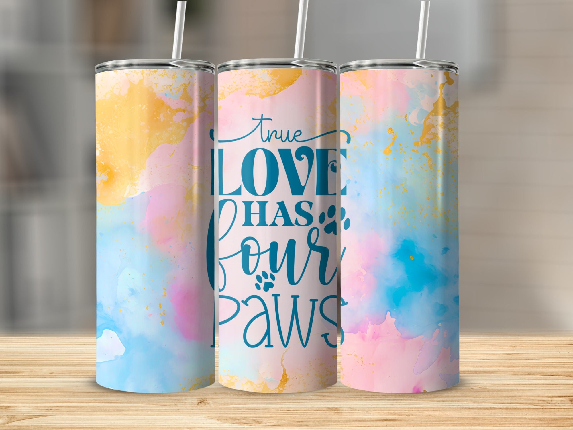 Tumbler with "True love has four paws" text and watercolor design.