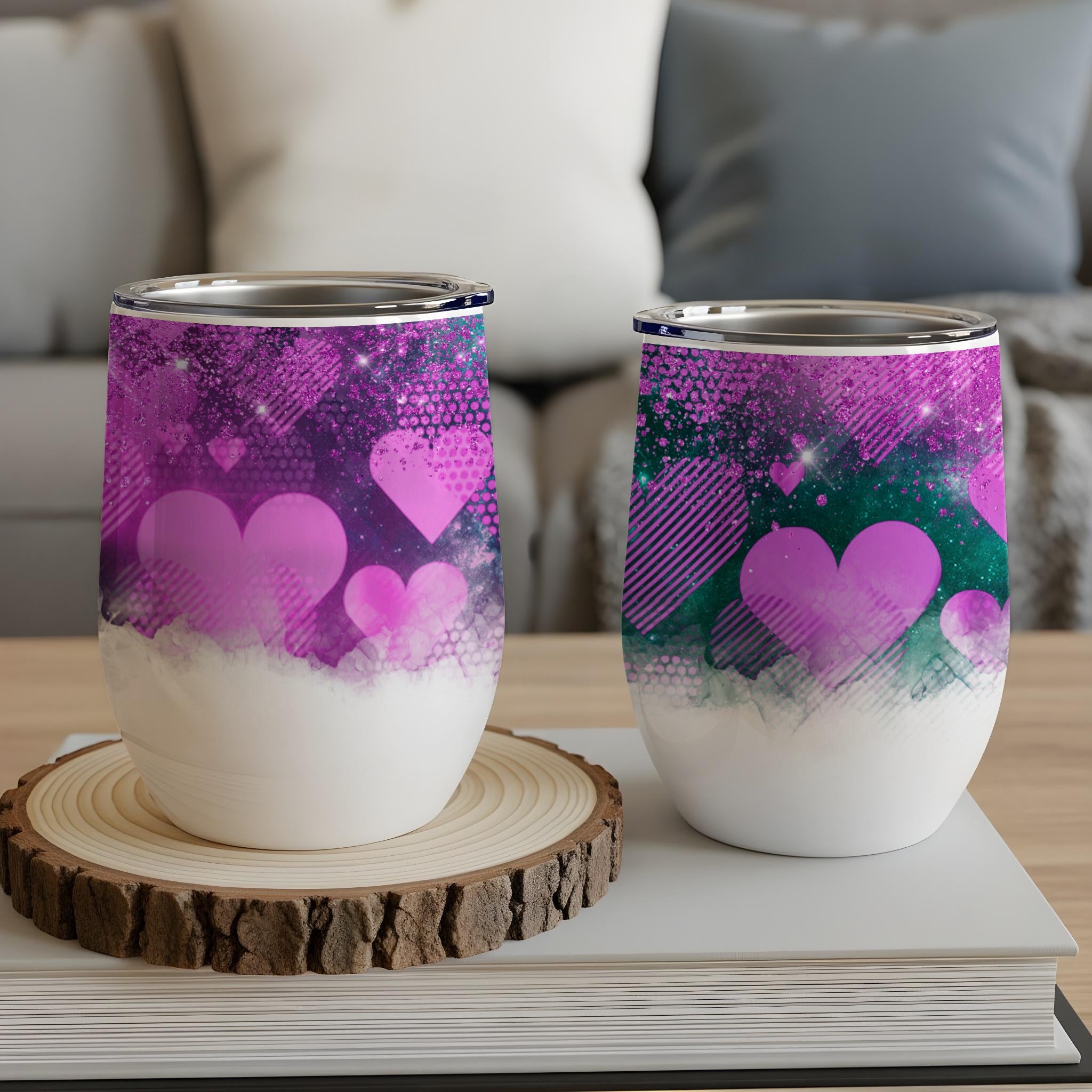 Two tumblers with purple and pink hearts and glitter designs.