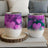 Two tumblers with purple and pink hearts and glitter designs.