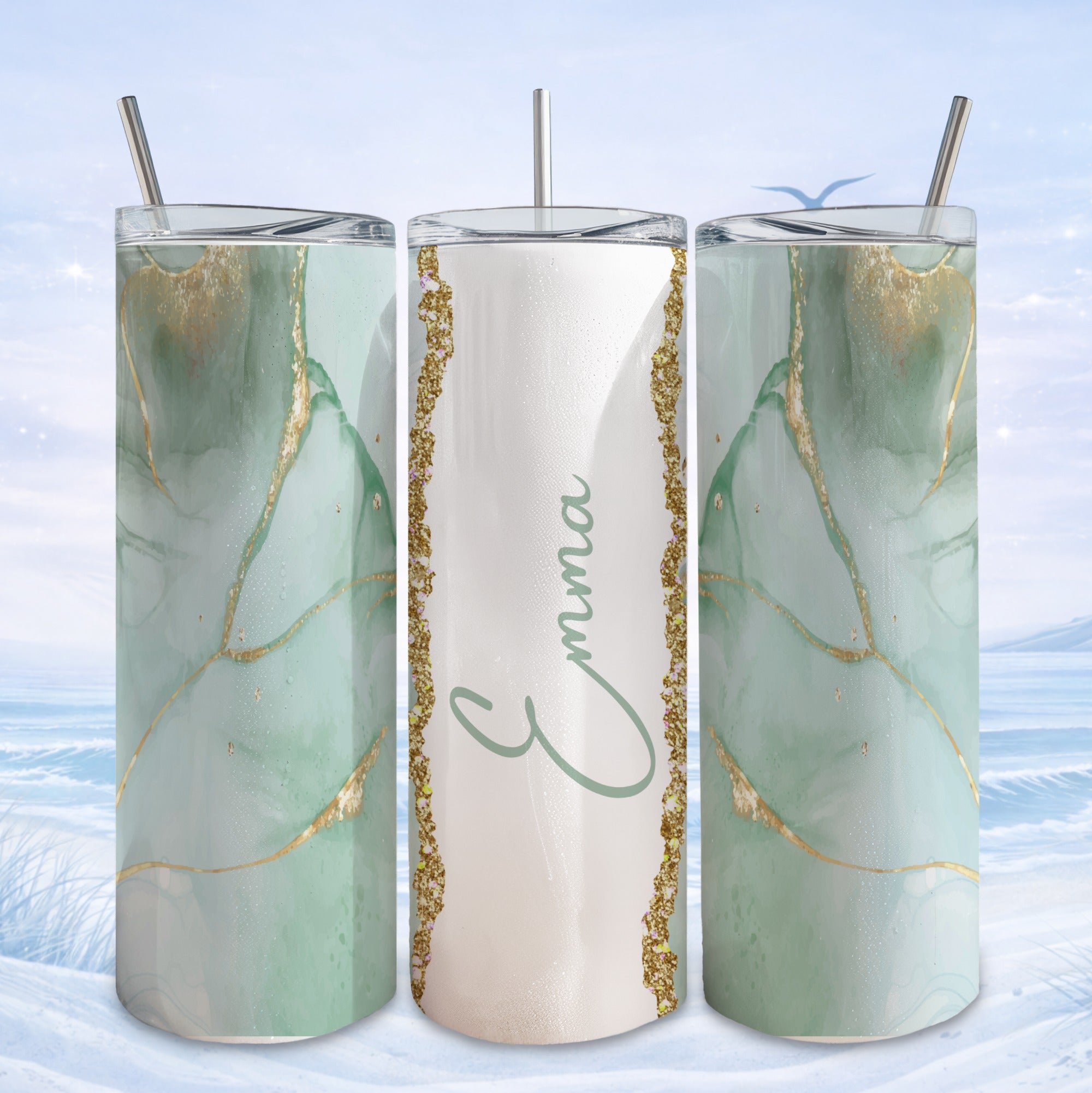 Mint green marbled tumbler with "Emma" in gold script on a glitter background.