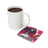 White mug of coffee beside a coaster with "I AM ENOUGH" text and floral design.
