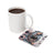 Woman with tattoos and sunflowers on coaster next to coffee mug.
