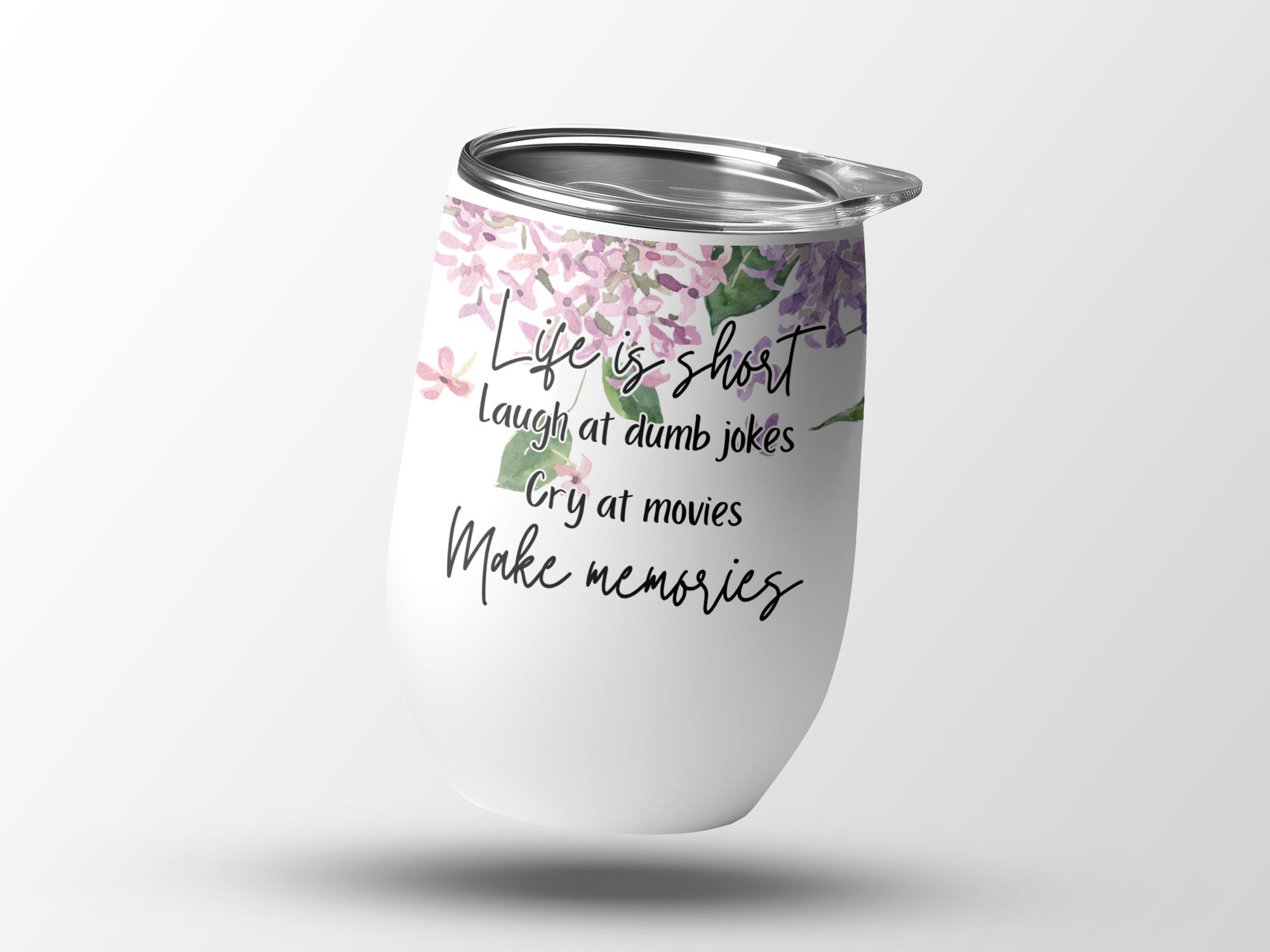 White insulated tumbler with floral accents and inspirational quote.