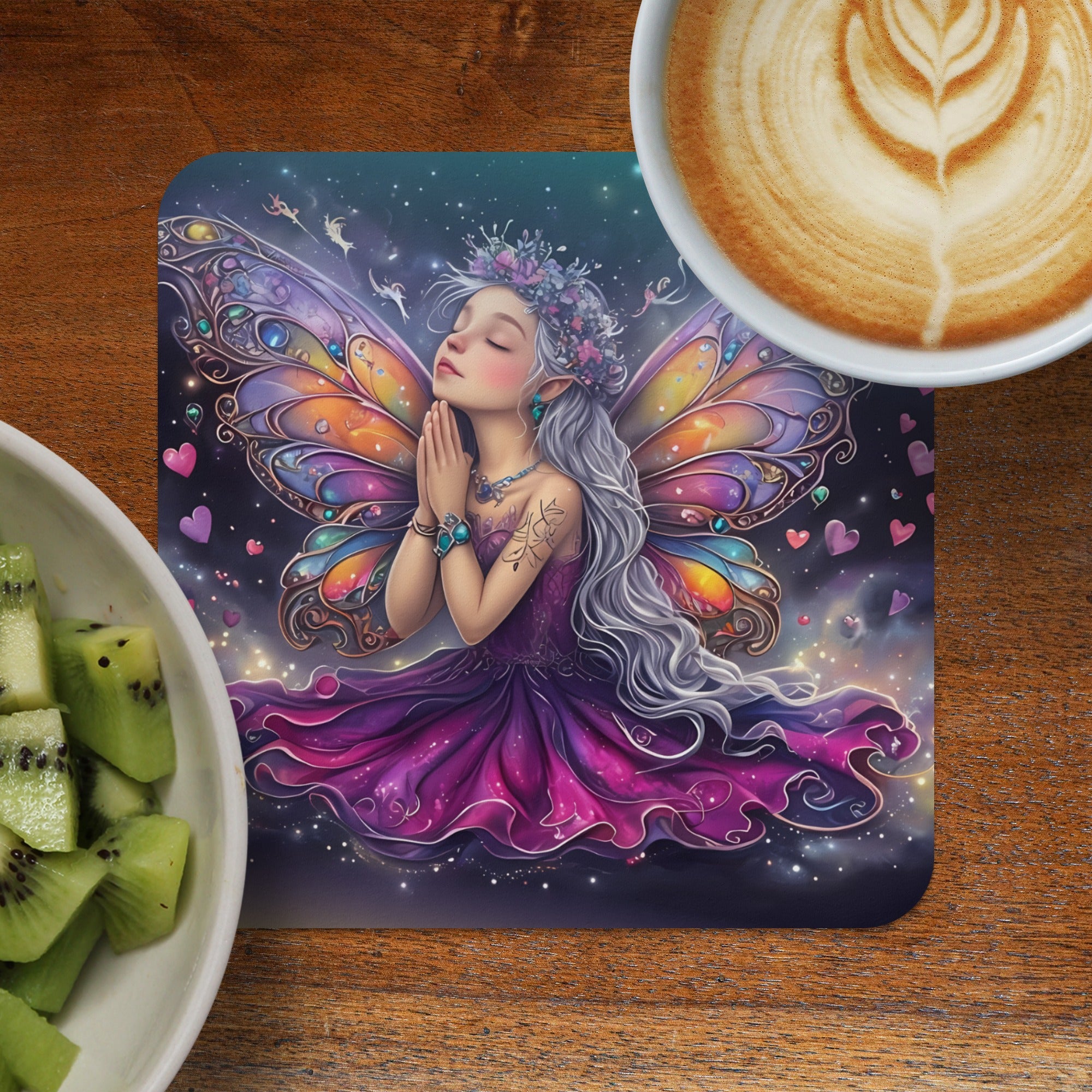 Fairy with colorful wings and purple dress praying, with coffee and kiwi.