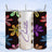 Tumbler with colorful floral pattern and "Charlotte" in gold glitter.