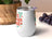 White tumbler with "Sweet Summer Time" in colorful lettering and small flower graphics.