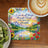 Coaster with floral border, landscape, and "I can do all things through Christ" Bible verse.
