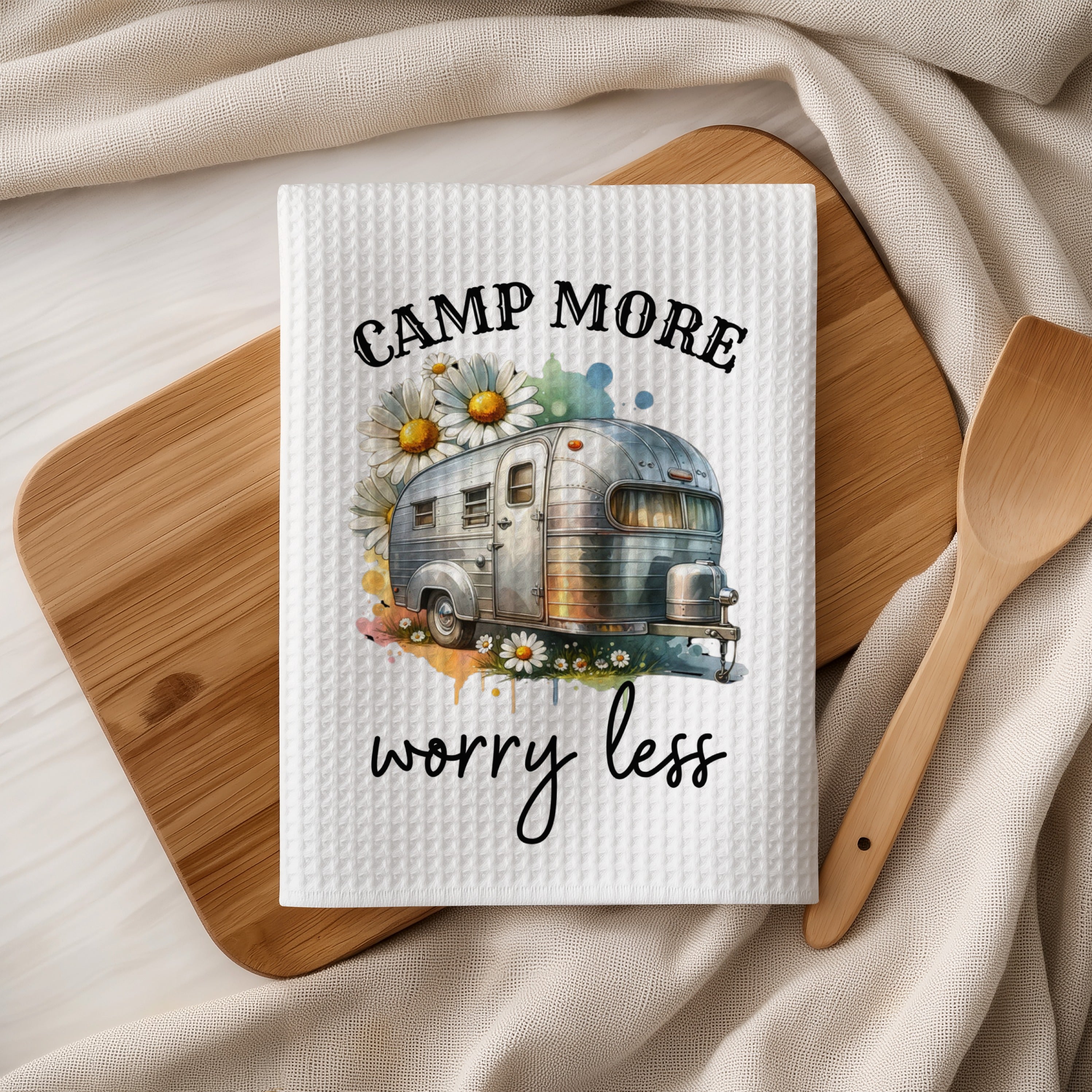 Woven towel with "Camp More Worry Less" and a vintage camper and daisies.