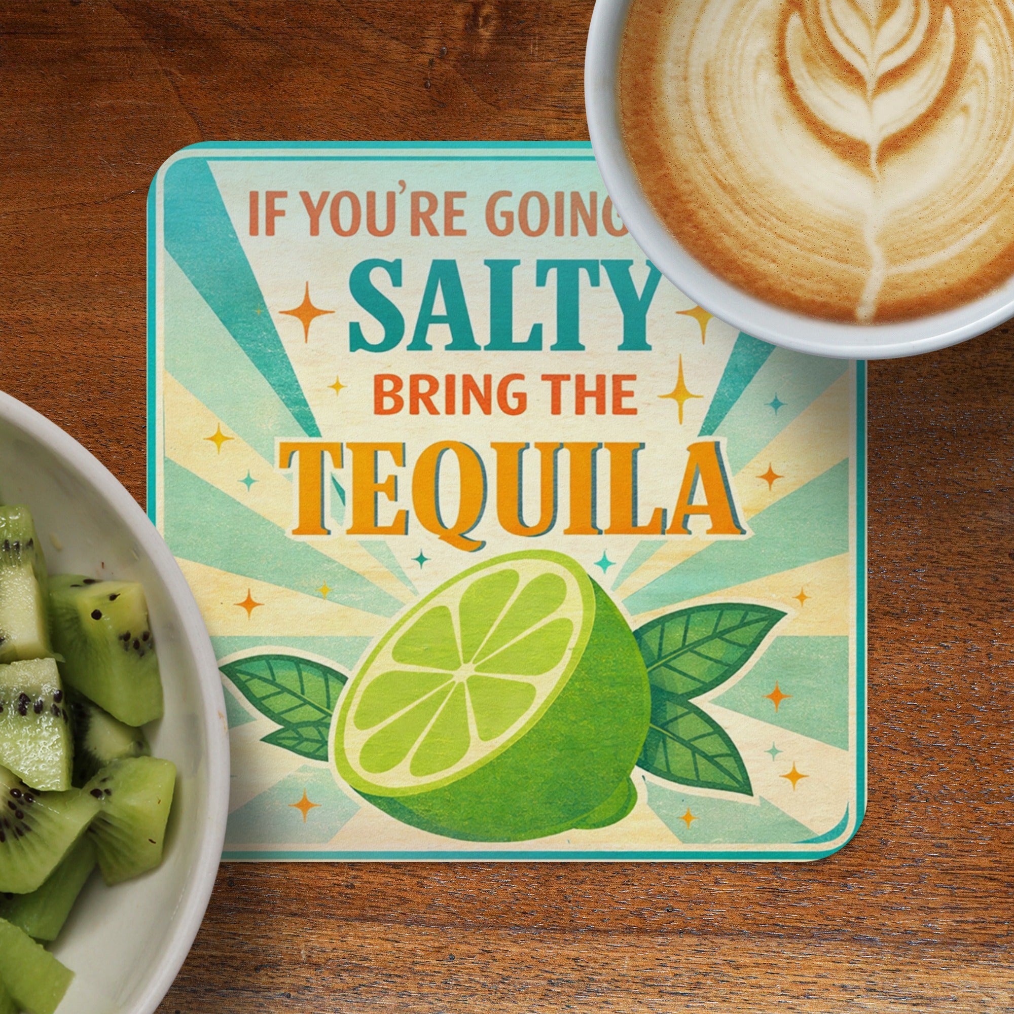 Coaster with "Salty Bring the Tequila" text and lime slice.