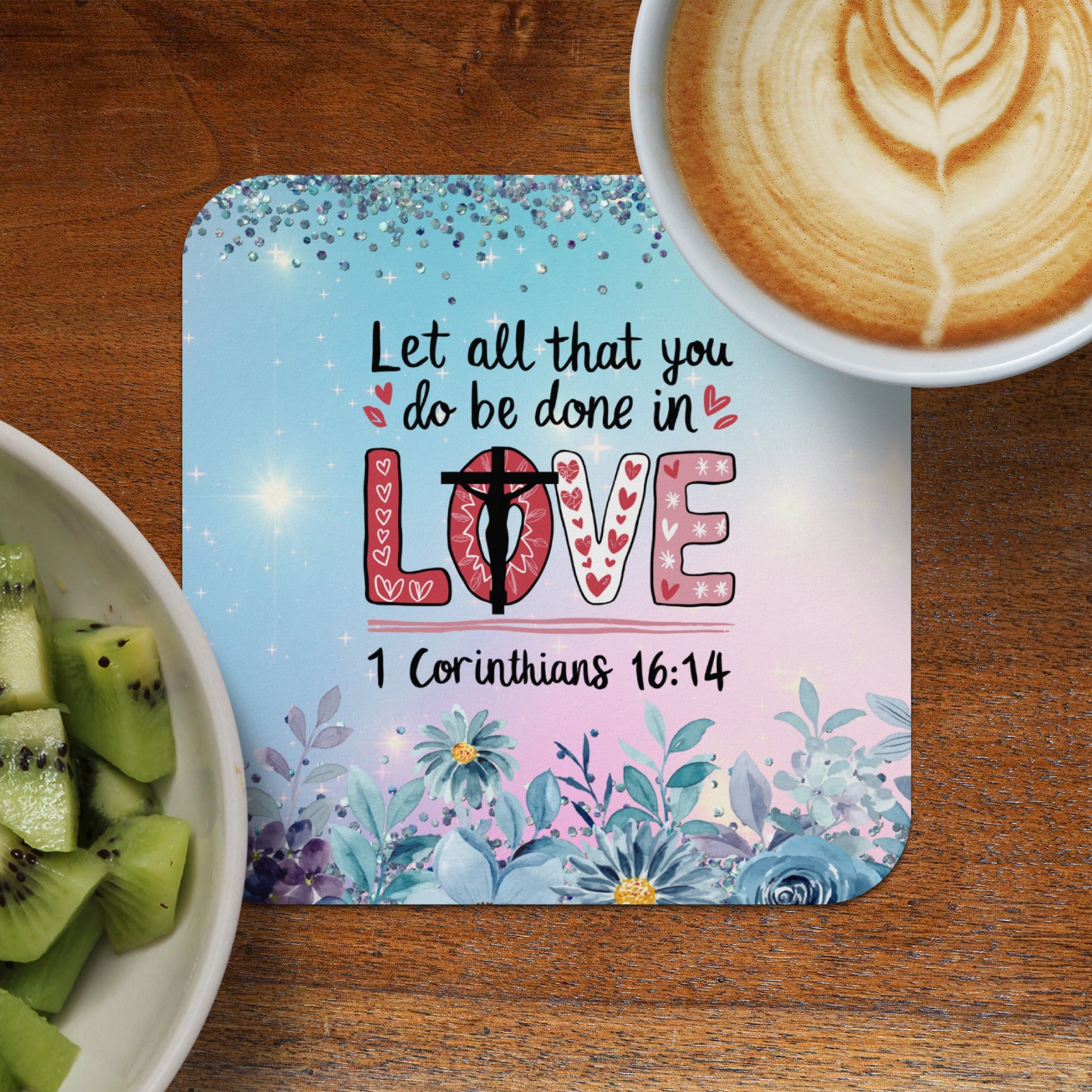 Let all that you do in love 1 Corinthians 16:14 coaster with a cup of coffee and kiwi.