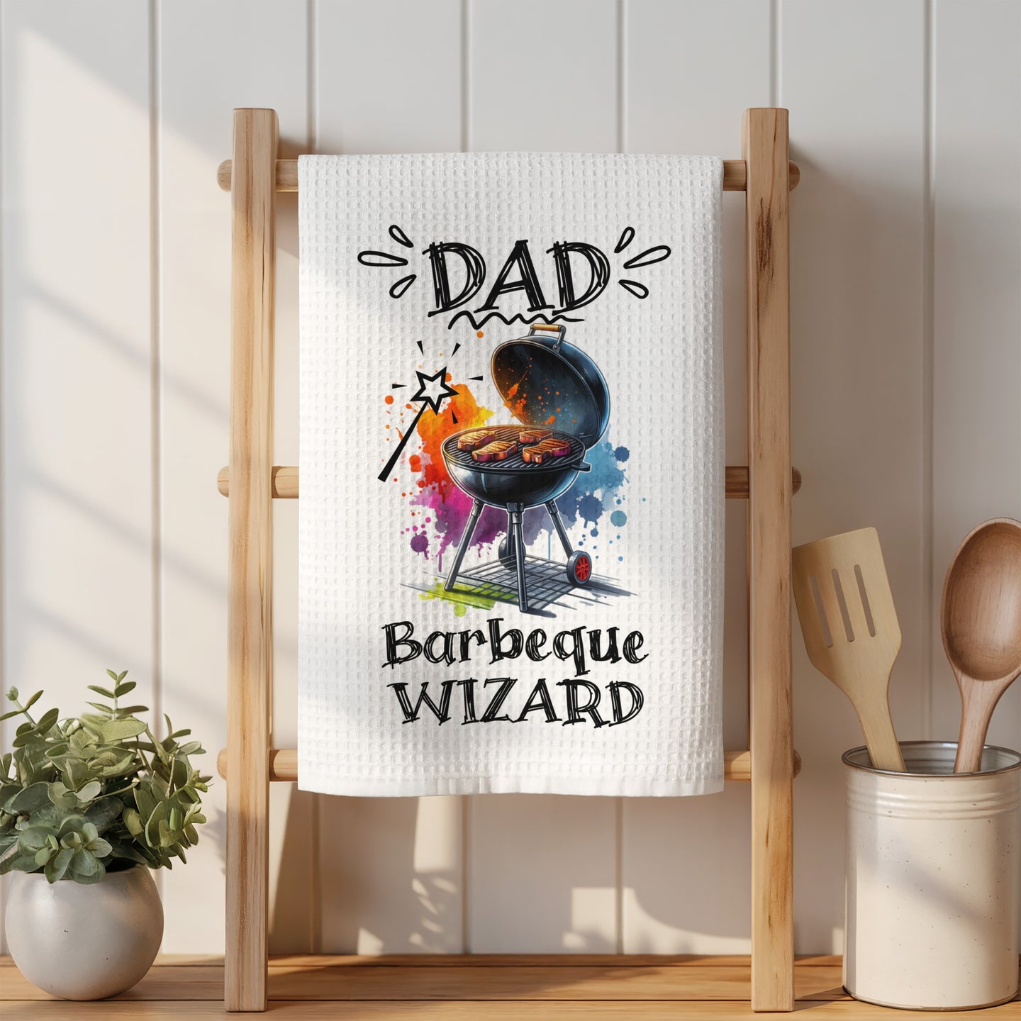 White waffle weave towel with "Barbeque Wizard" text and colorful grill graphic.