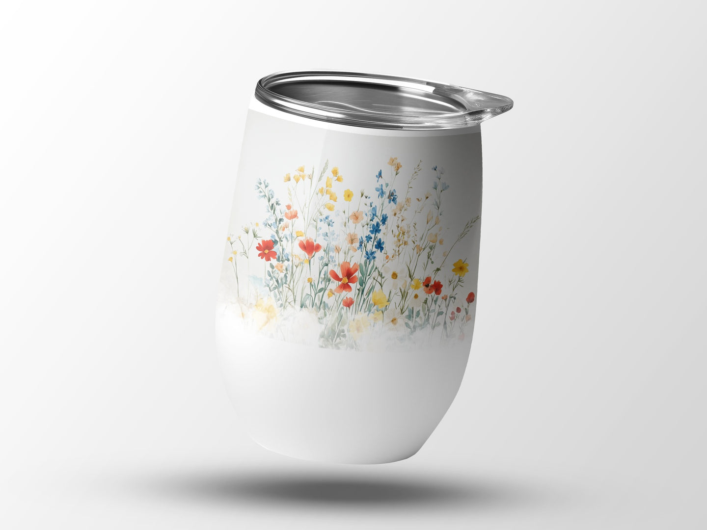 White tumbler with a watercolor wildflower floral pattern.