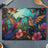 Two colorful hummingbirds touch beaks amidst vibrant flowers and foliage.