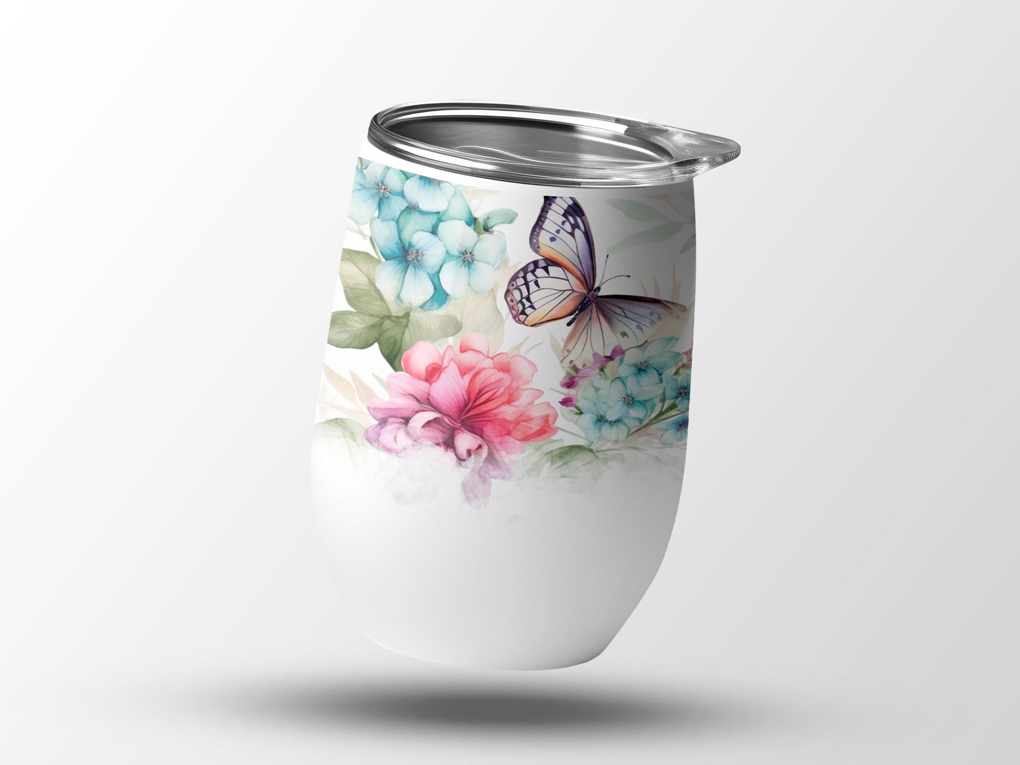 White tumbler with watercolor butterfly and floral design.