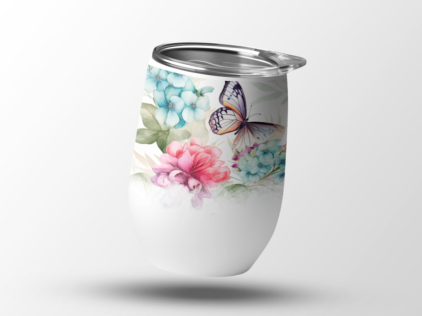 White tumbler with watercolor butterfly and floral design.