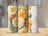 Three tumblers with yellow floral designs, one personalized with "Hailey".