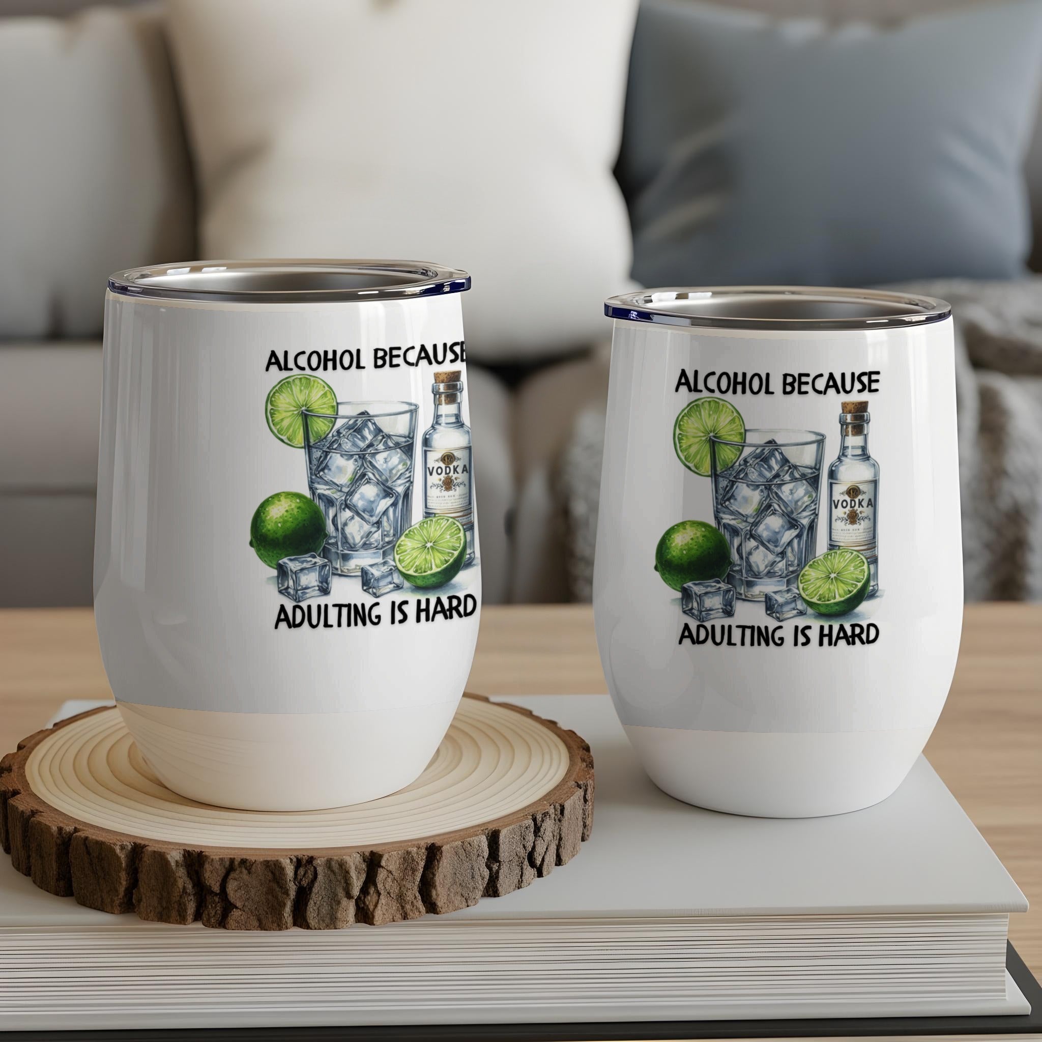 Two wine tumblers with "Alcohol Because Adulting is Hard" text and drink illustration.