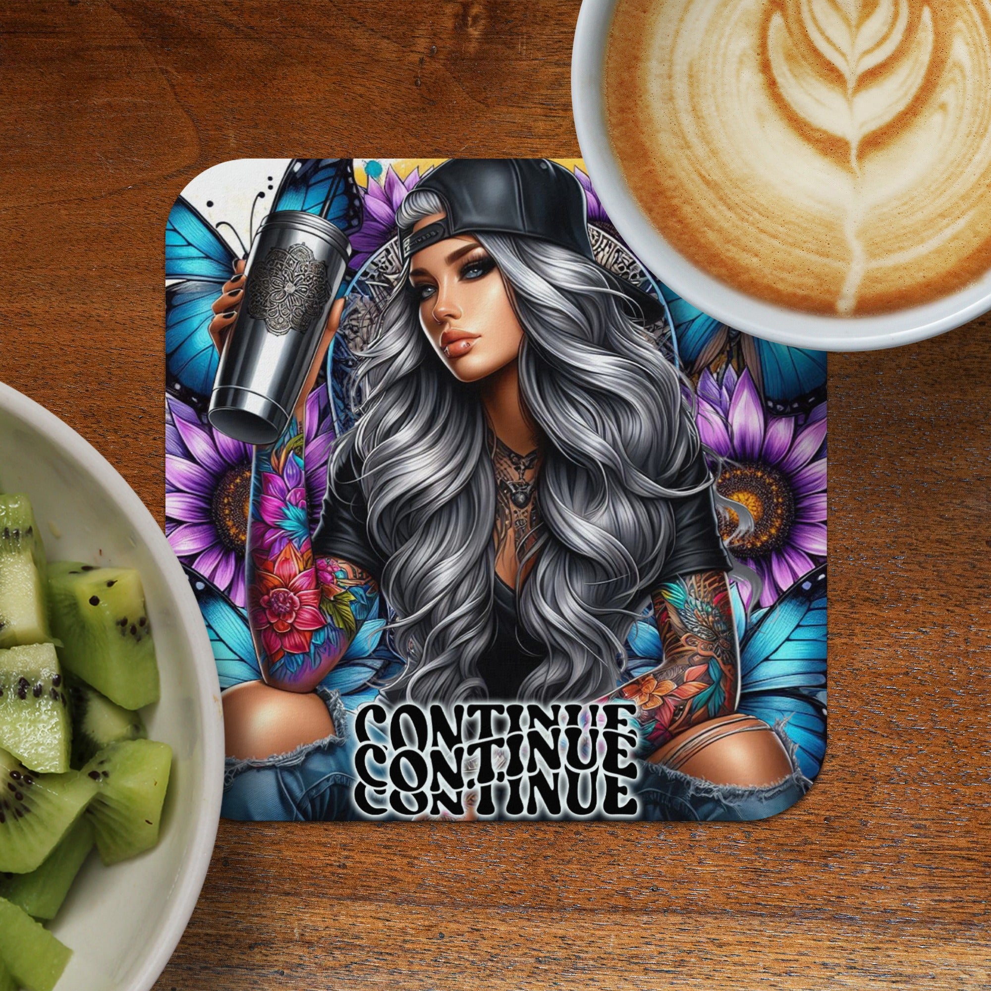 Woman with tattoos holding a cup, surrounded by sunflowers and butterflies.