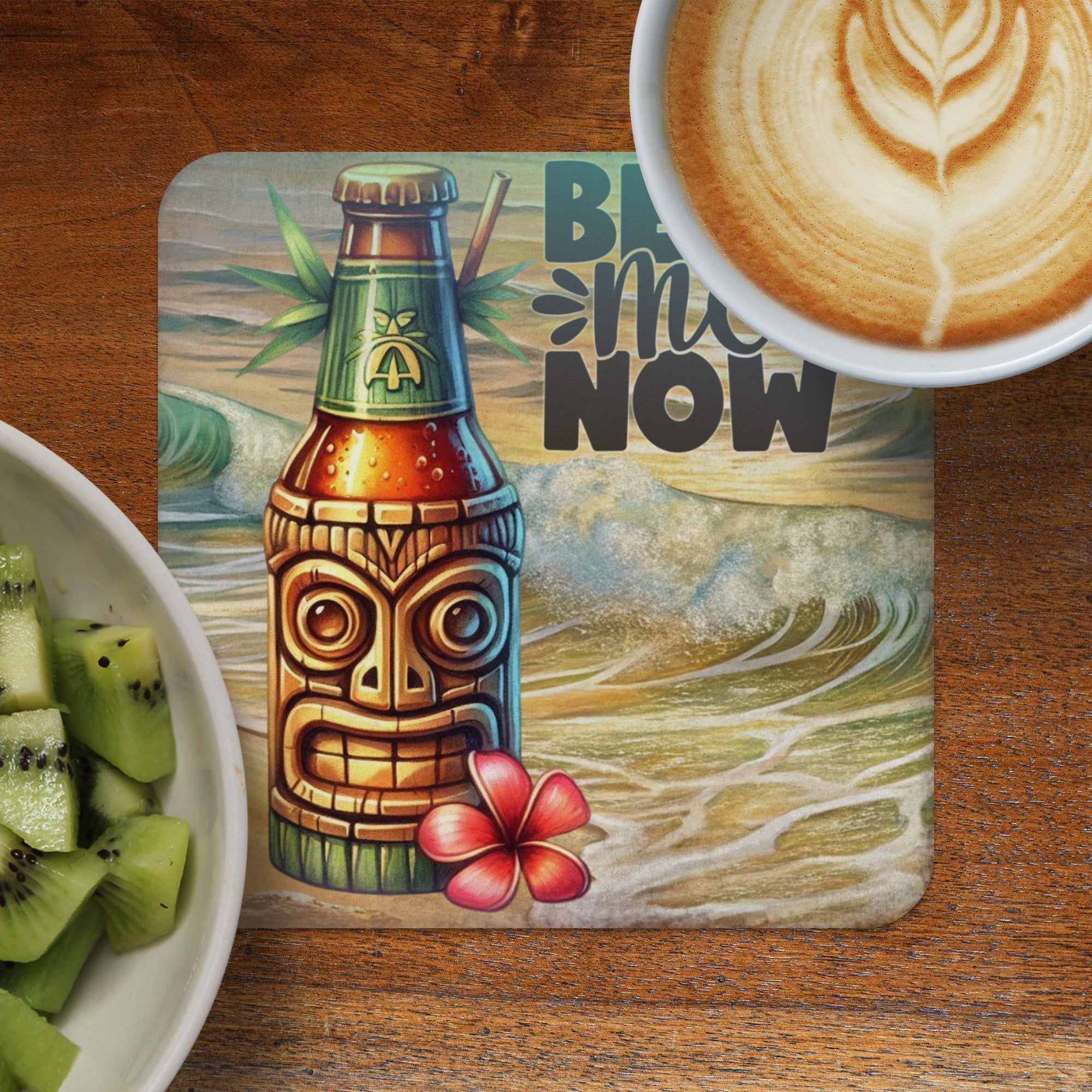 Tiki-themed beer bottle coaster with tropical waves and text "BE HERE NOW".