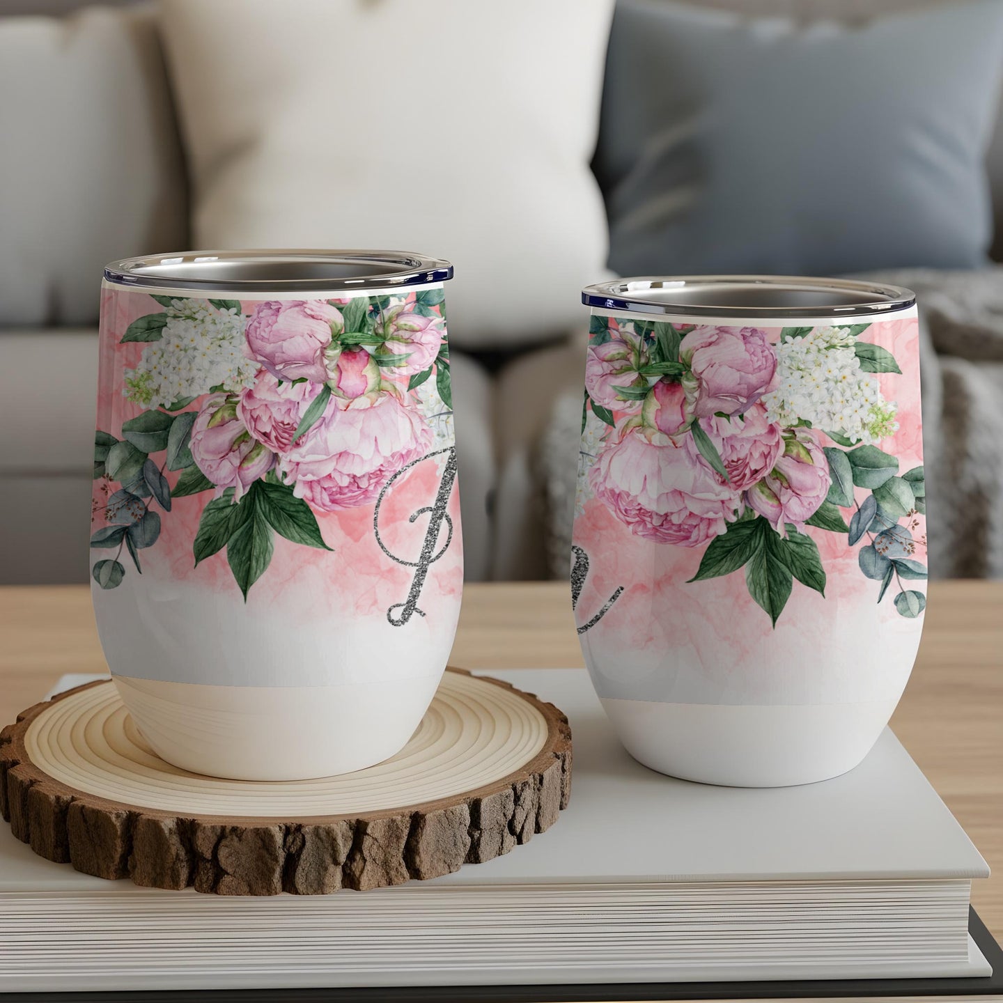 Two wine tumblers with floral design and "Mom" text.