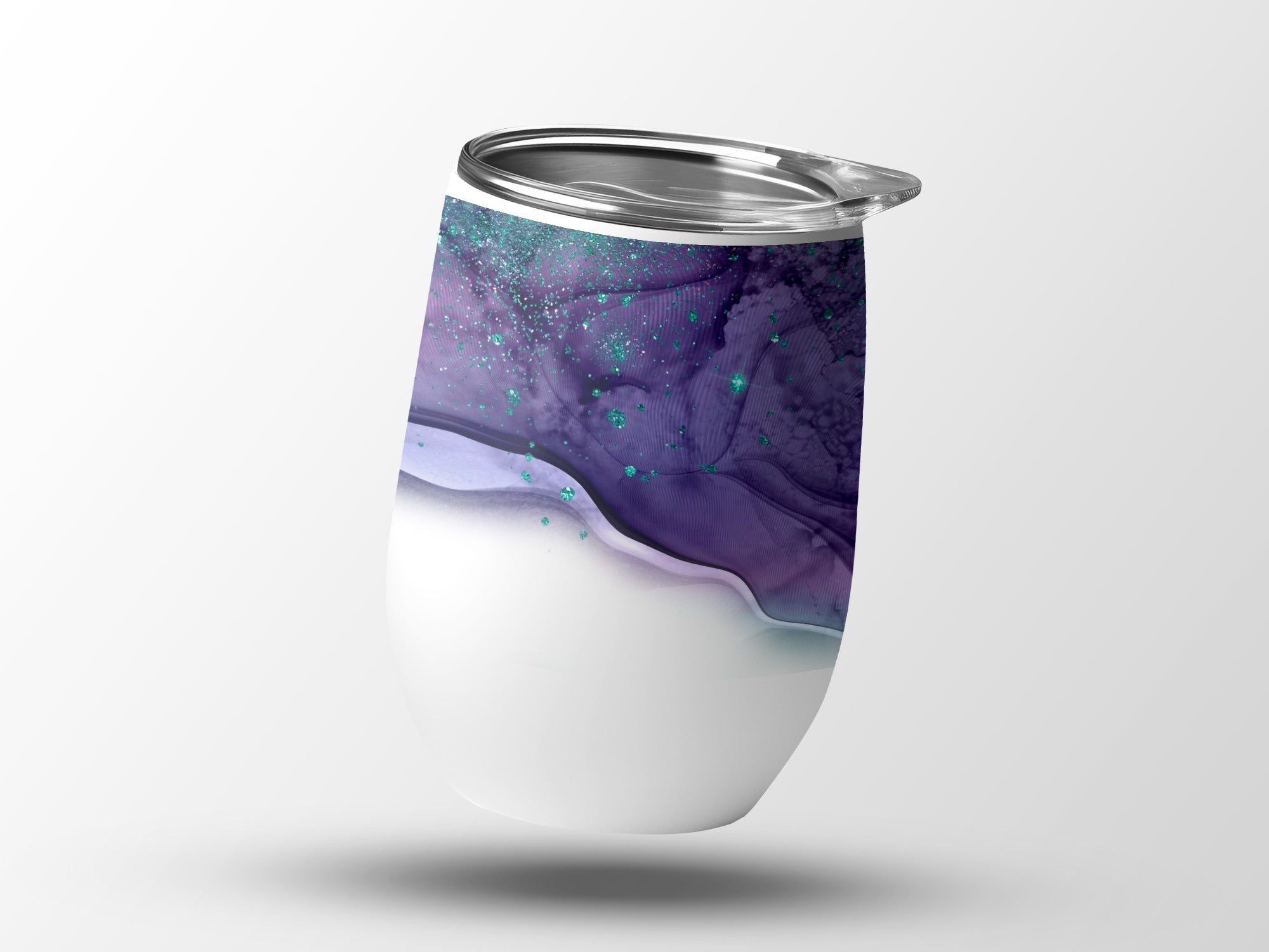 White tumbler with purple and teal marbled design and silver lid.