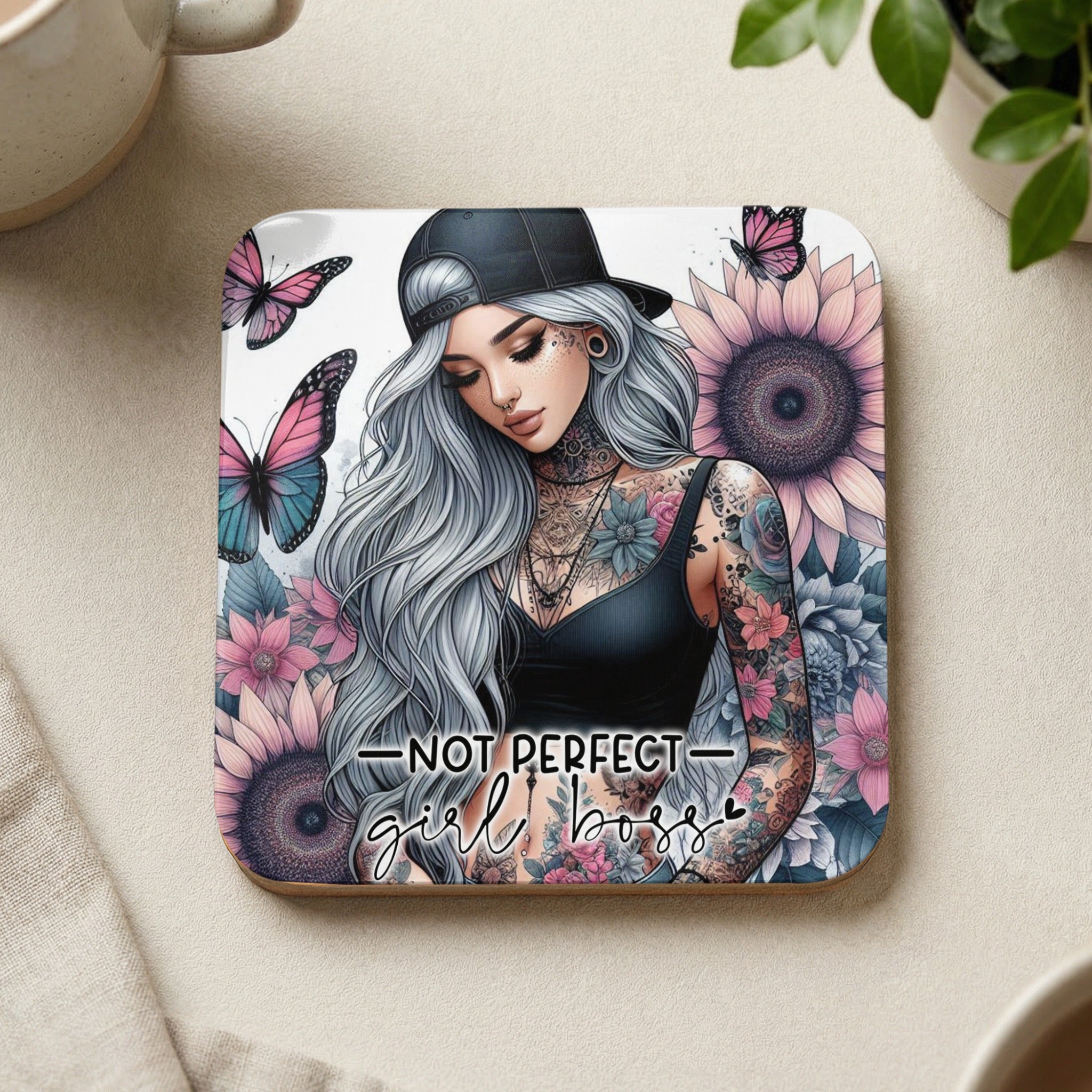 Tattooed woman wearing a black crop top and baseball cap, with butterflies and sunflowers.