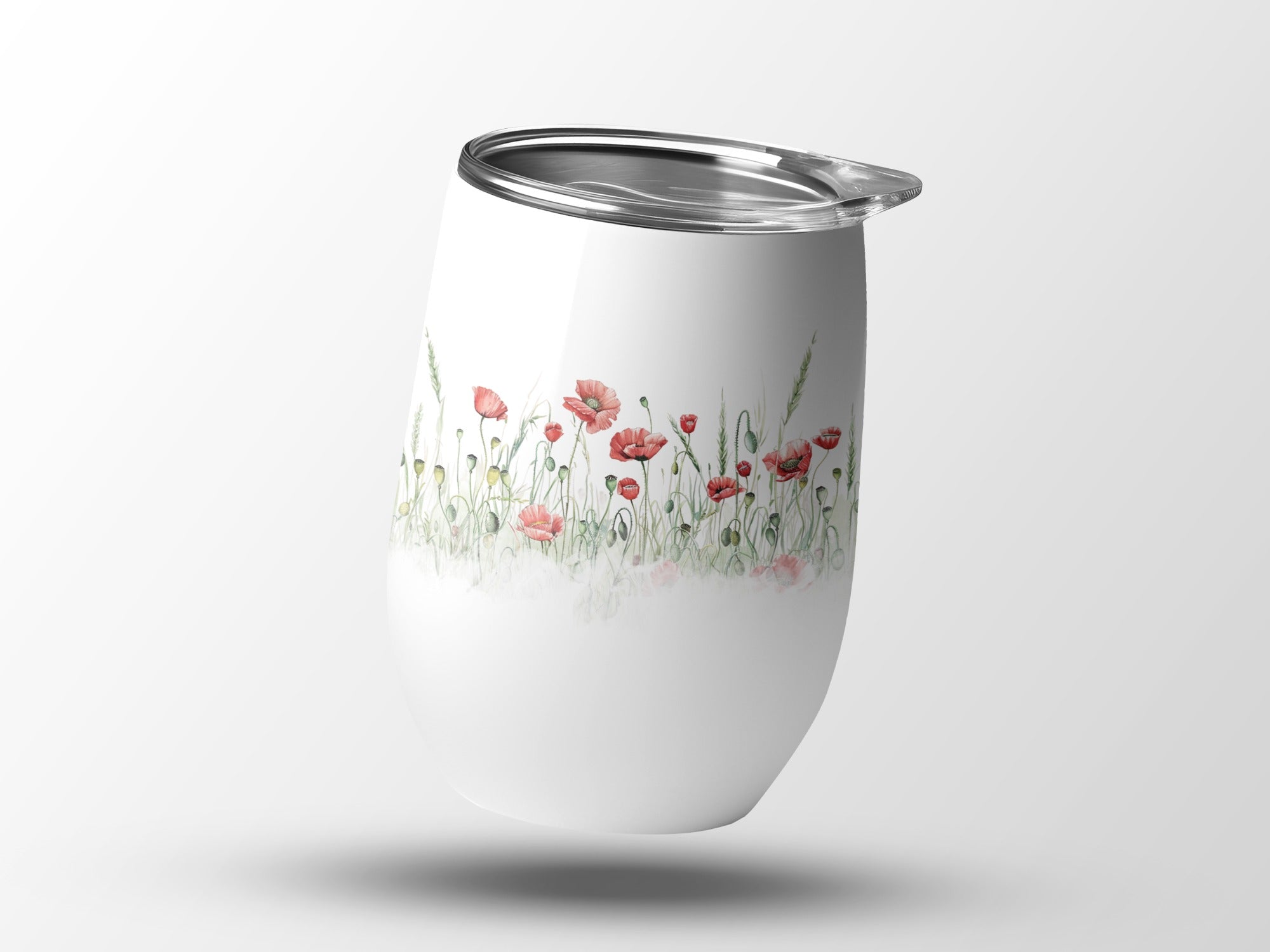 White tumbler with watercolor poppies and greenery design.