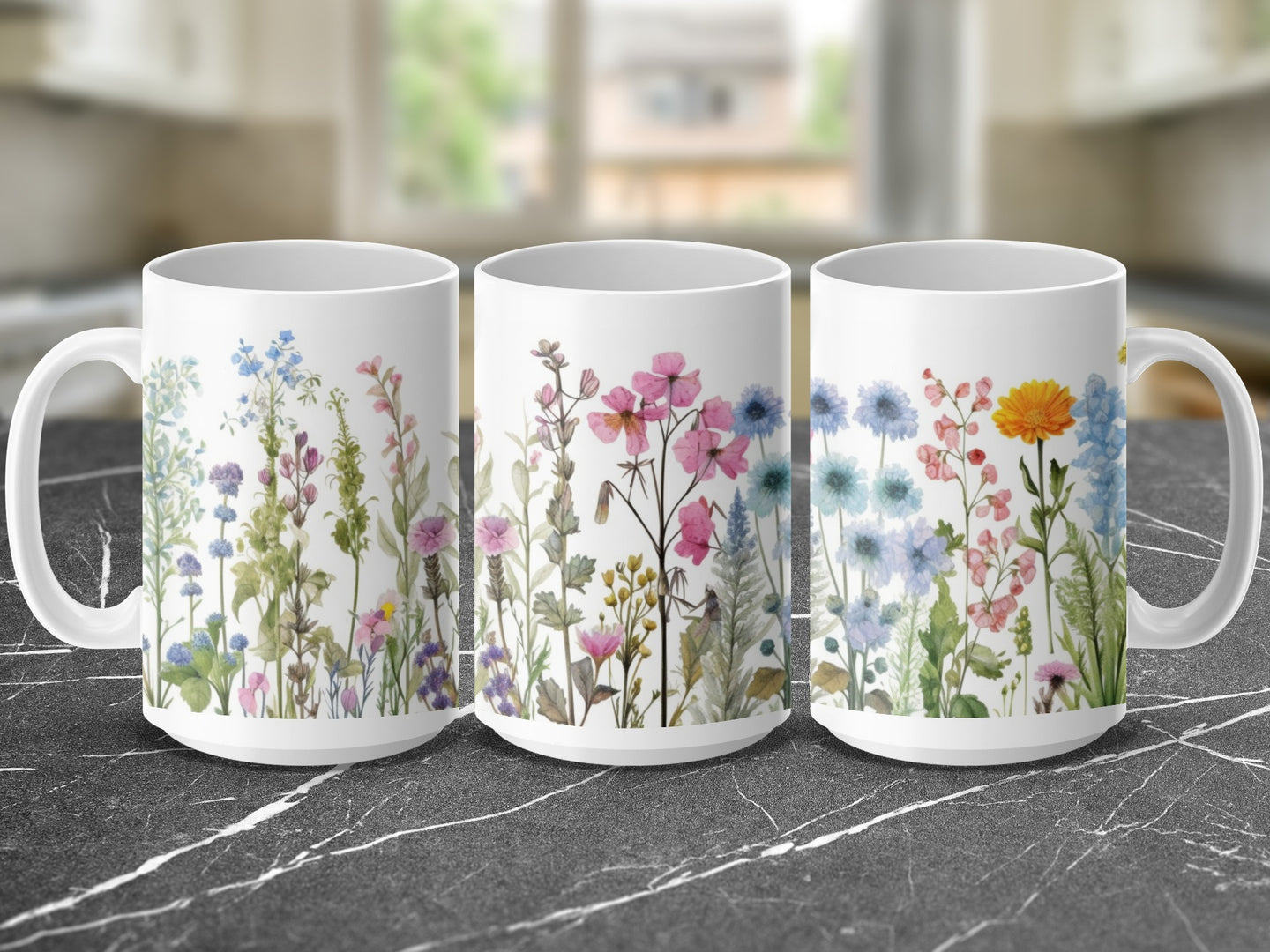 Three white mugs featuring watercolor wildflowers in various colors.
