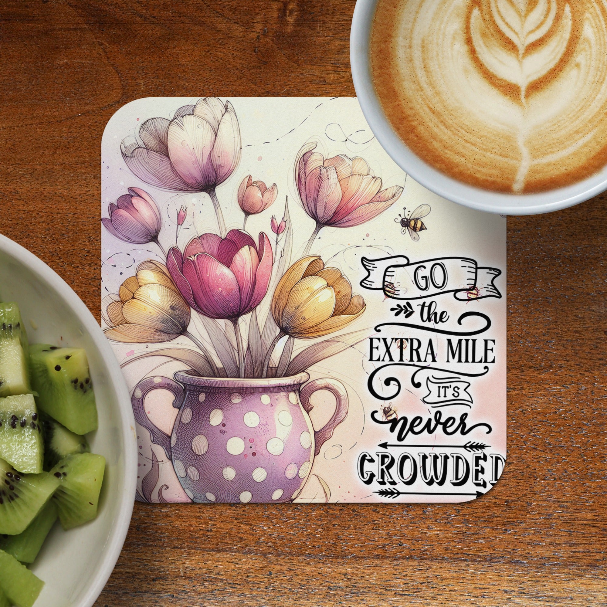 Tulips in polka dot vase with inspirational text and coffee.