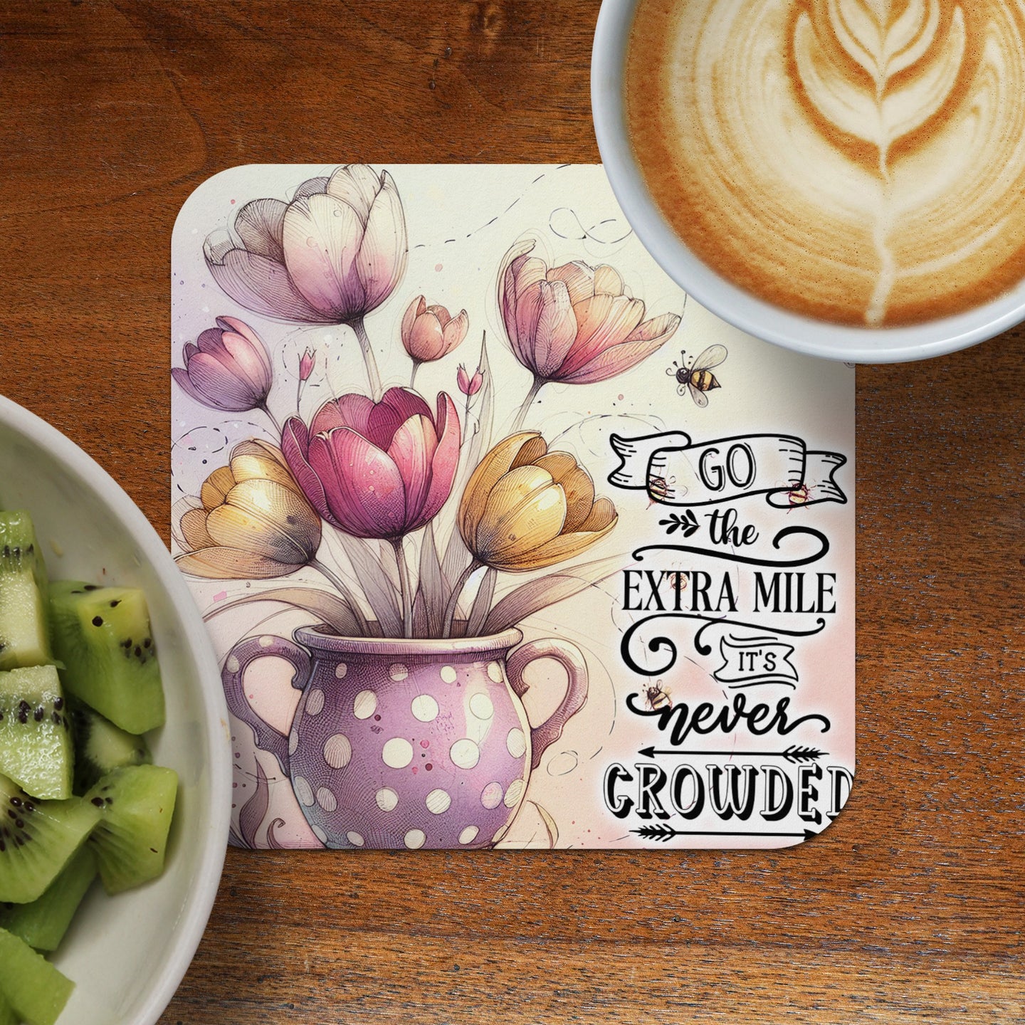 Tulips in polka dot vase with inspirational text and coffee.