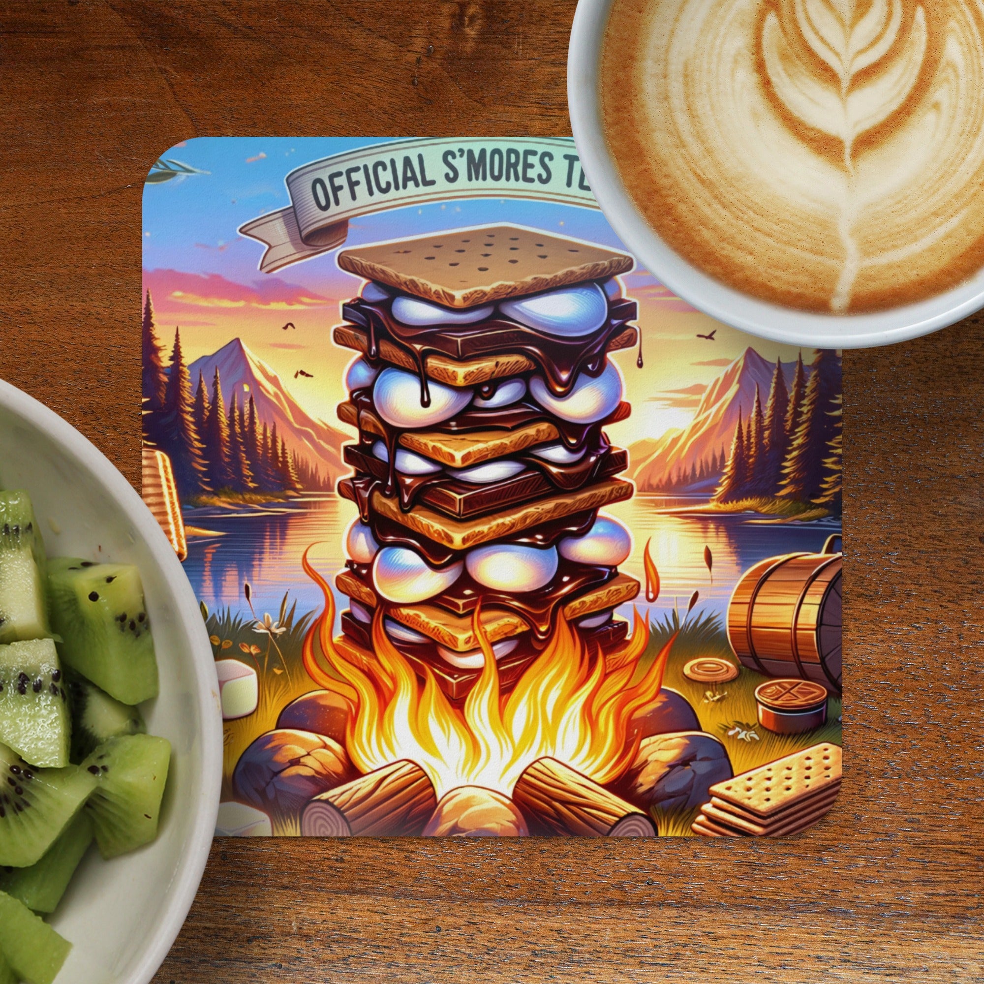 Stack of s'mores with campfire and latte art on wooden table.