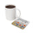 White mug with coffee next to floral coaster reading "BELIEVE IN yourself".