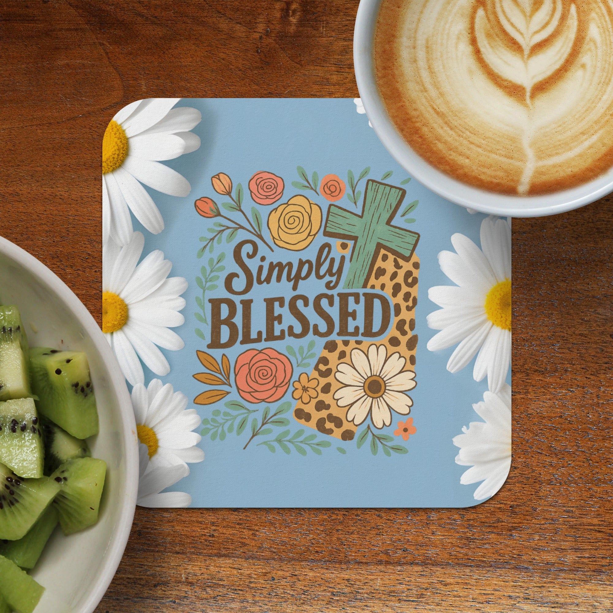 Light blue coaster with "Simply Blessed" text, cross, flowers, and leopard print.