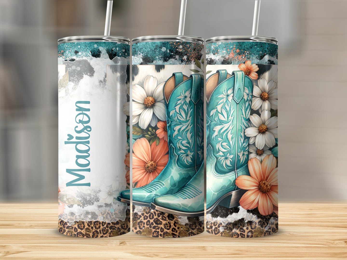 Turquoise cowboy boots with flowers and leopard print on a tumbler.