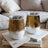 Two wine tumblers with a tiger stripe and gold glitter pattern.