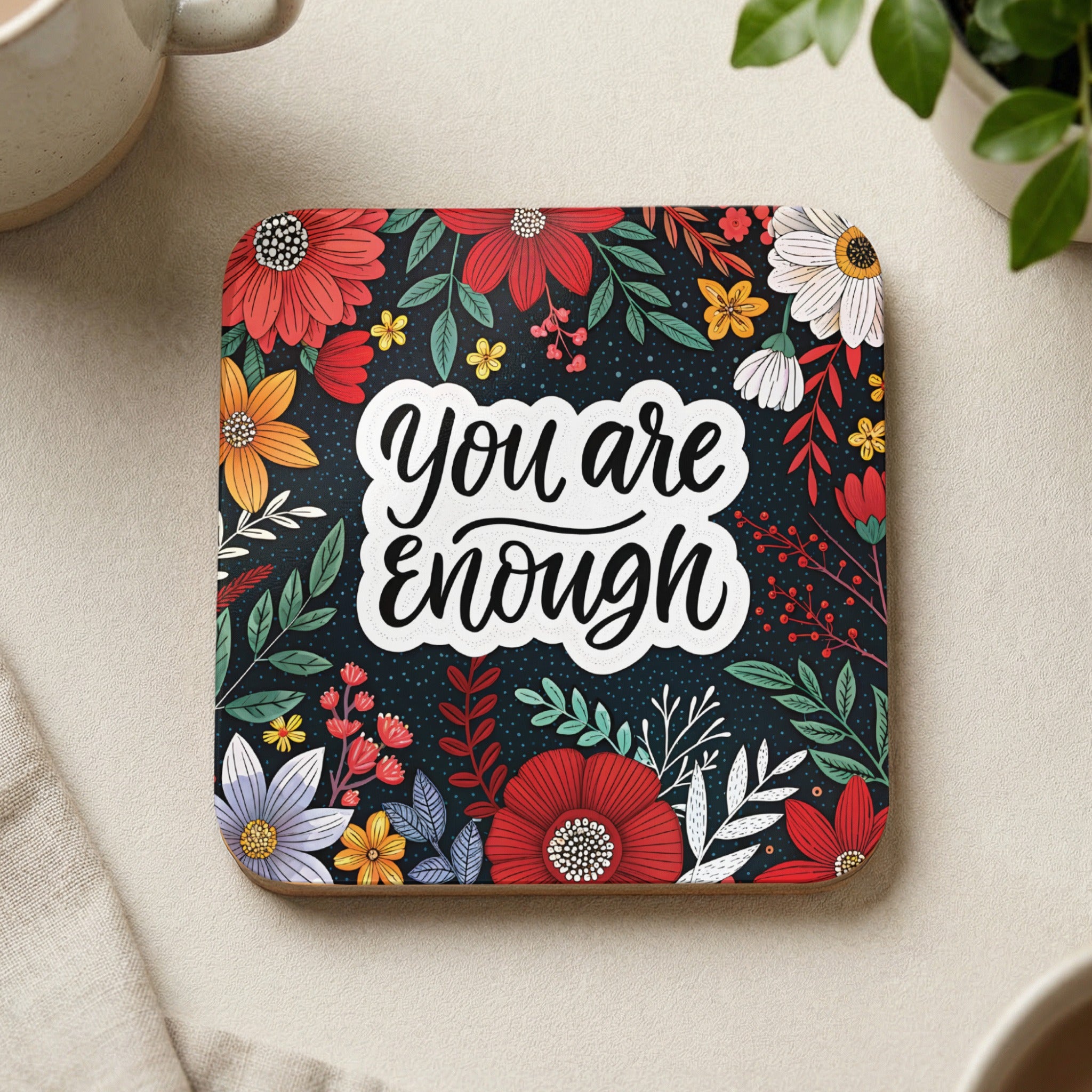 Square coaster with "You are enough" in script surrounded by colorful flowers.