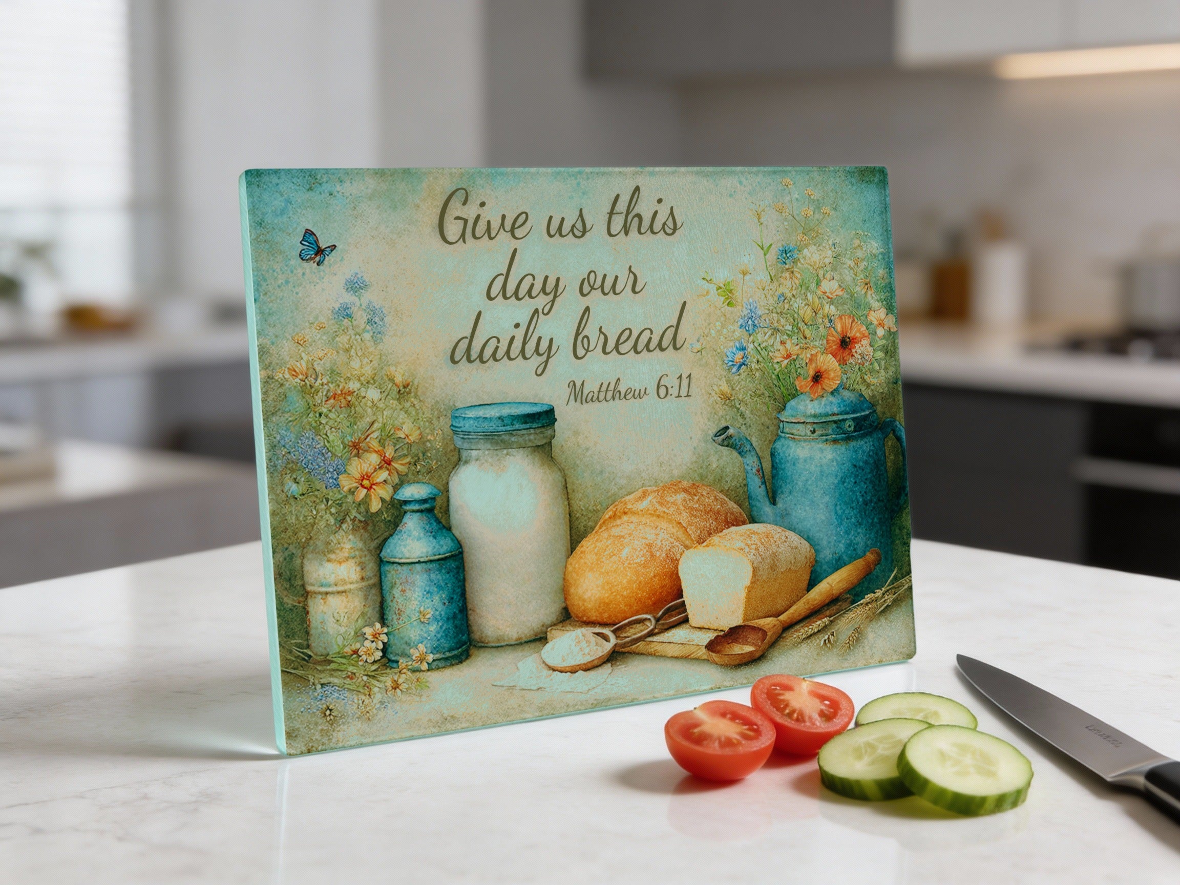 Cutting board with "Give us this day our daily bread" and bread, jar, tomatoes, cucumber.