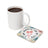 White mug of coffee next to a square coaster with flowers and text "I AM GRATEFUL FOR MY LIFE".