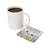White mug of coffee next to a coaster with watercolor flowers and "you are enough" text.