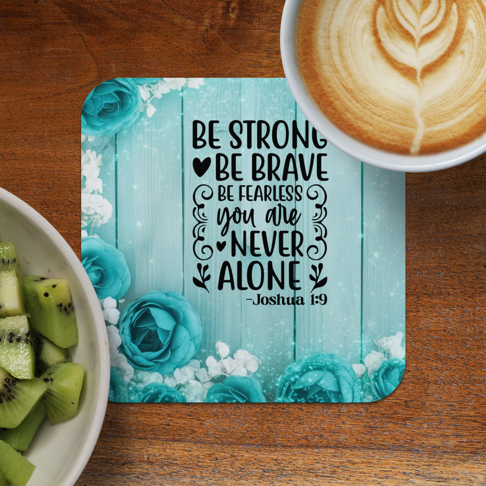 Coaster with "Be Strong, Be Brave, Be Fearless, You Are Never Alone - Joshua 1:9" and floral design.