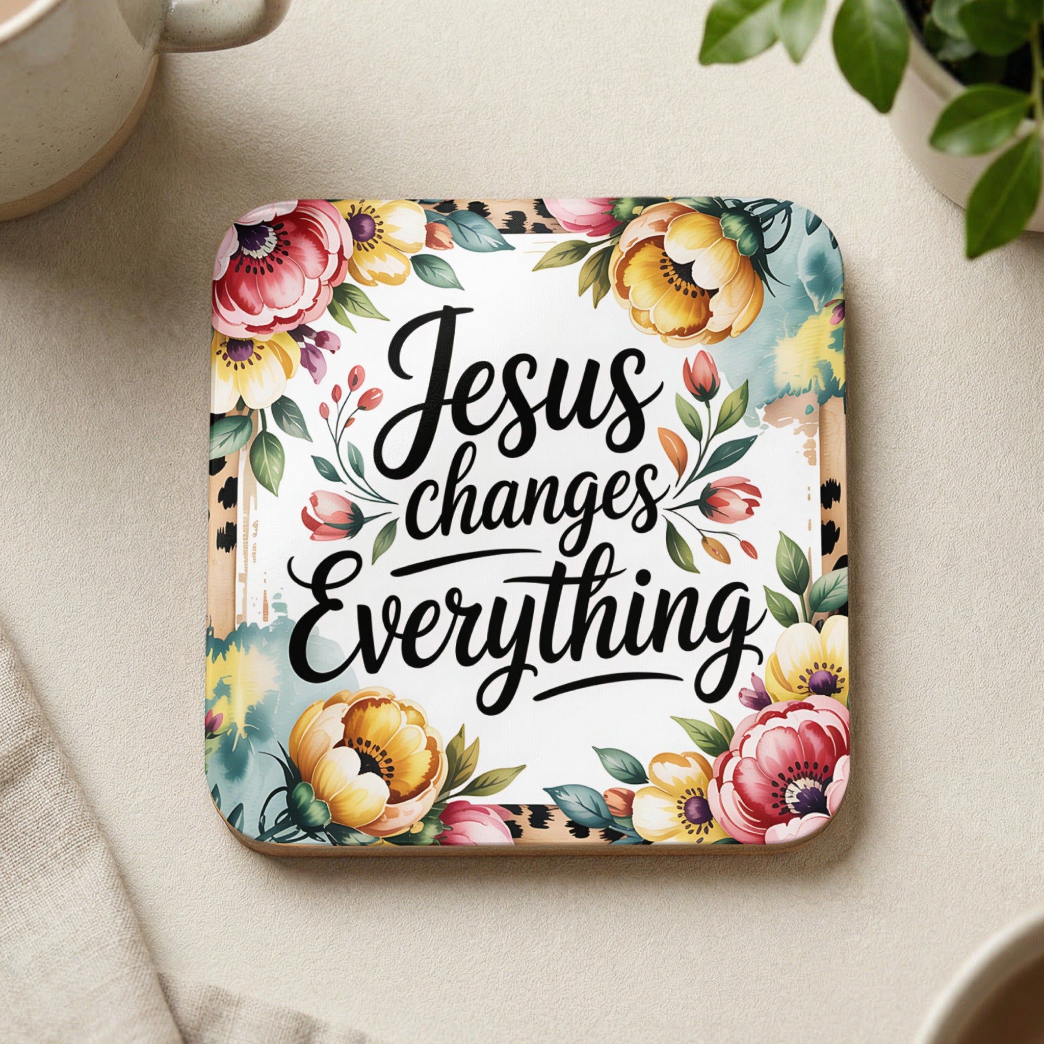 Coaster with "Jesus changes everything" text and floral border.