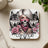 Coaster with skull, roses, wolves, and the word "continue".